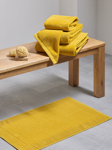 Коврик для ванной с фактурным бортиком цвета охры из коллекции e 3